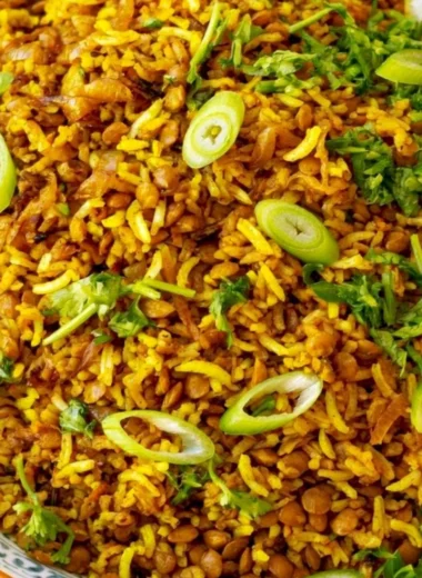 Bowl of Mediterranean Lentils and Rice garnished with herbs and spices.