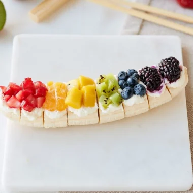 Rainbow Fruit Banana Sushi with colorful fruits wrapped around a banana