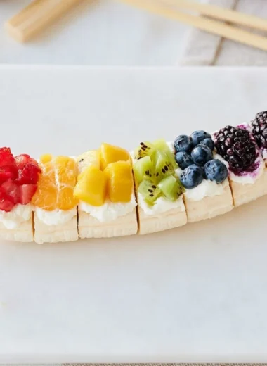 Rainbow Fruit Banana Sushi with colorful fruits wrapped around a banana