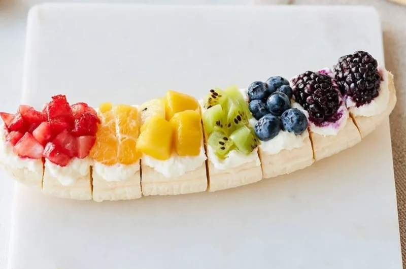 Rainbow Fruit Banana Sushi with colorful fruits wrapped around a banana