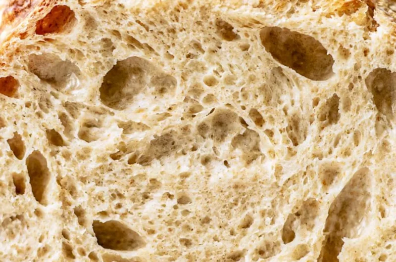 Freshly baked sourdough bread with a golden crust and airy crumb.