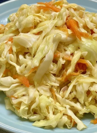 Vinegar and oil coleslaw served in a bowl, showcasing fresh vegetables and dressing