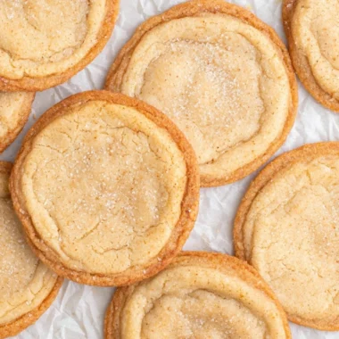 A plate of homemade brown butter sugar cookies with a golden-brown hue