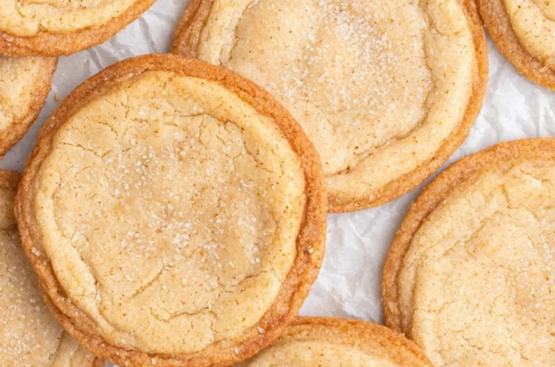 A plate of homemade brown butter sugar cookies with a golden-brown hue