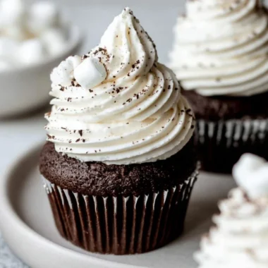 Hot chocolate cupcakes with marshmallow buttercream frosting on a plate