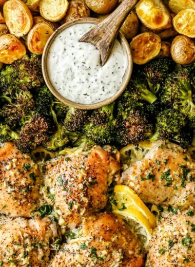 Delicious Lemon Garlic Chicken with potatoes and broccoli on a sheet pan